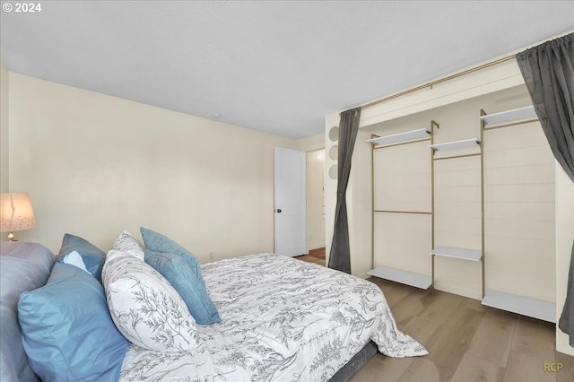 bedroom featuring hardwood / wood-style floors