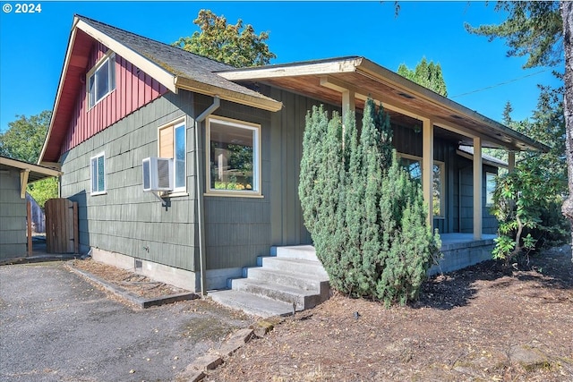 view of front of house featuring cooling unit