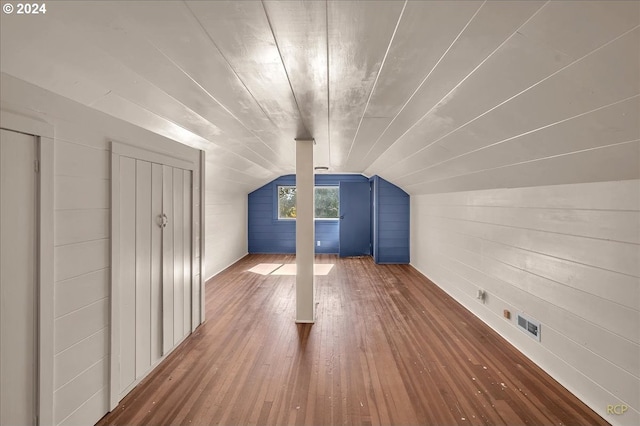 bonus room featuring hardwood / wood-style flooring and vaulted ceiling