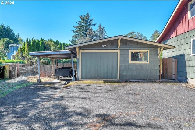 garage featuring a carport