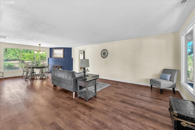 living room with a fireplace and dark hardwood / wood-style flooring