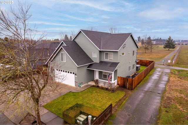 view of front of house featuring a garage and a porch