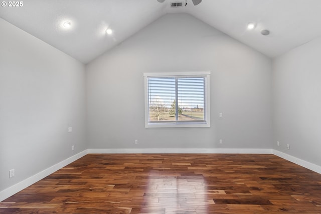 unfurnished room with ceiling fan, dark hardwood / wood-style flooring, and vaulted ceiling