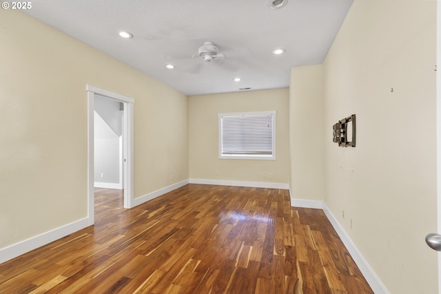 spare room with recessed lighting, ceiling fan, baseboards, and wood finished floors