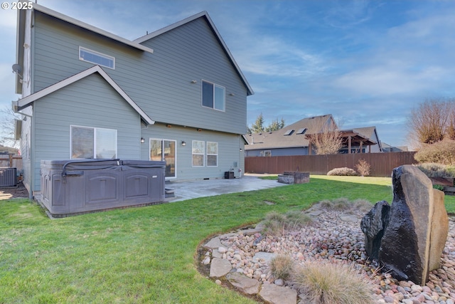 back of property featuring a yard, a patio area, fence, and central air condition unit