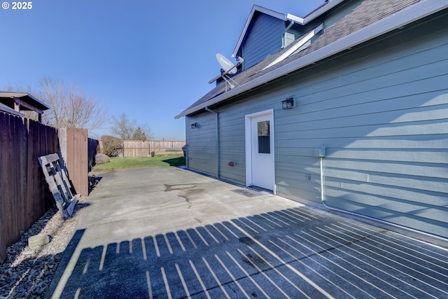 view of patio featuring fence