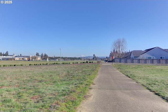 view of street featuring a rural view and traffic signs