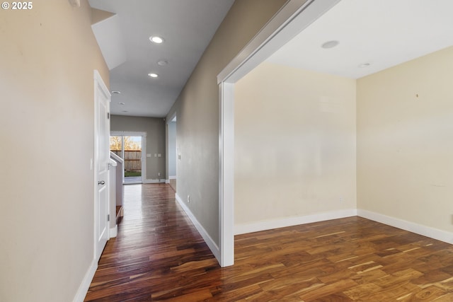 corridor featuring dark wood-type flooring