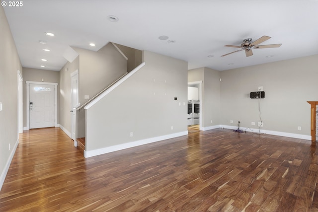 unfurnished living room with ceiling fan and dark hardwood / wood-style flooring