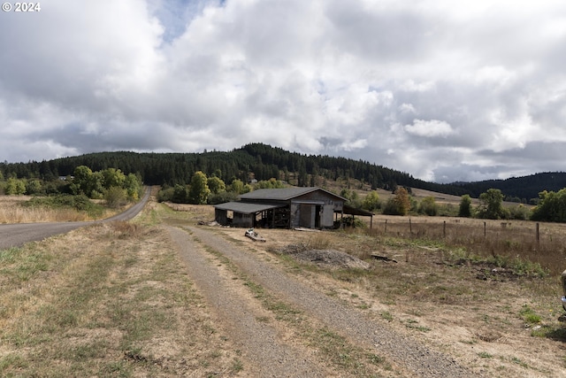 view of mountain feature with a rural view