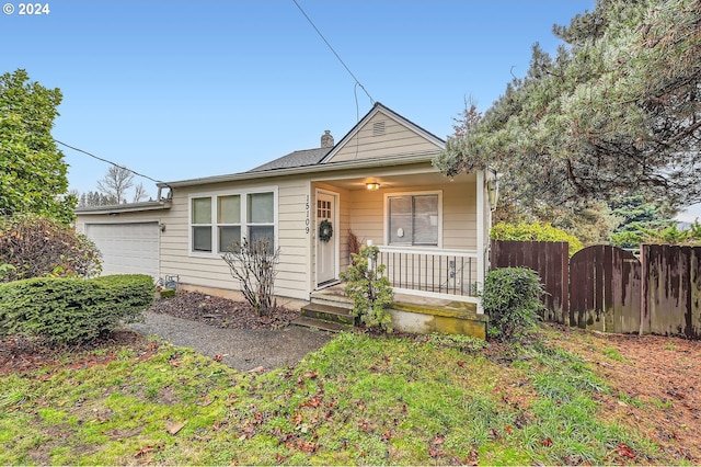 view of front of property featuring a garage and a porch