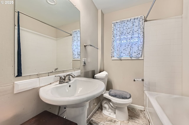 bathroom with shower / tub combo and toilet