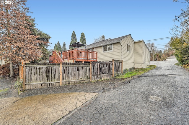 view of home's exterior featuring a deck