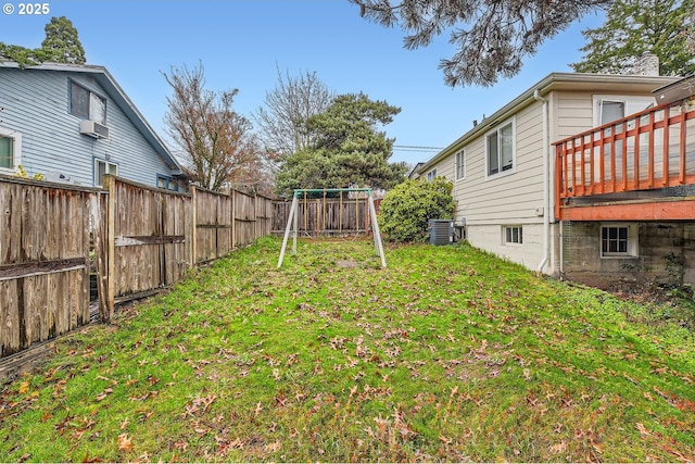 view of yard featuring cooling unit and a playground