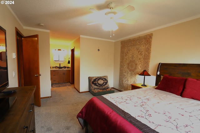 bedroom with ceiling fan, light colored carpet, ensuite bathroom, and ornamental molding