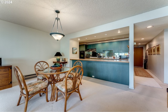 carpeted dining area with a baseboard radiator and a textured ceiling