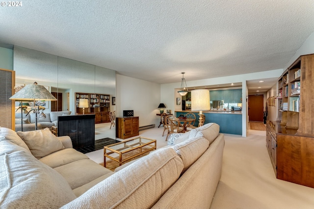 carpeted living room with a textured ceiling and a baseboard heating unit