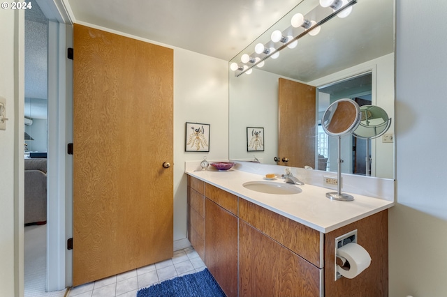 bathroom with tile patterned flooring and vanity