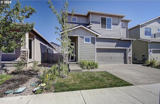 view of front of property featuring a garage, driveway, and board and batten siding