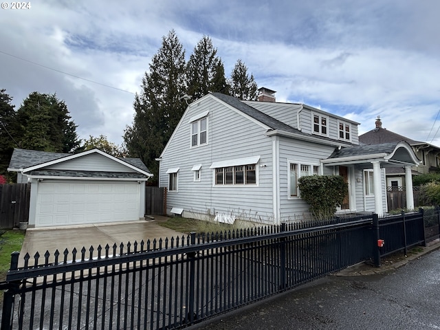 view of front of home with an outdoor structure and a garage