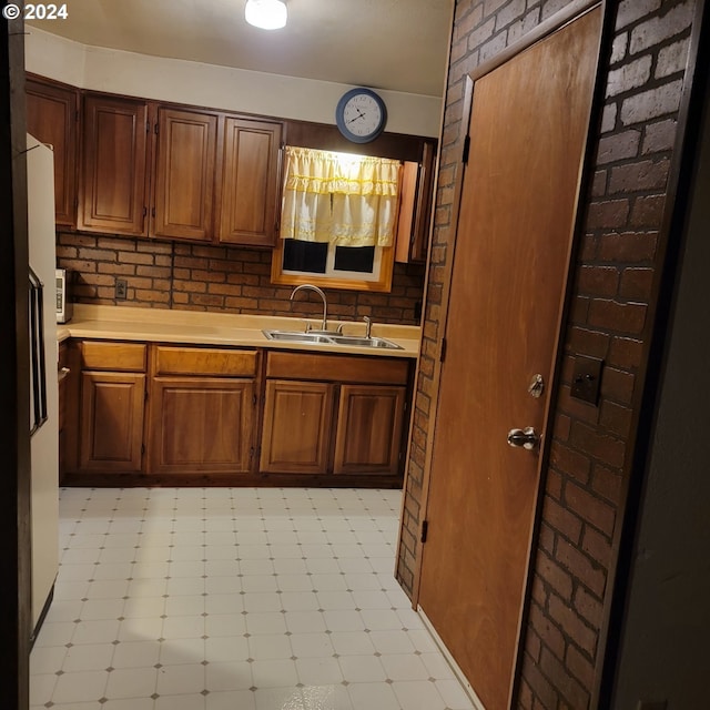 kitchen featuring decorative backsplash and sink