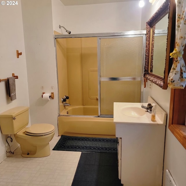 full bathroom with shower / bath combination with glass door, toilet, and vanity