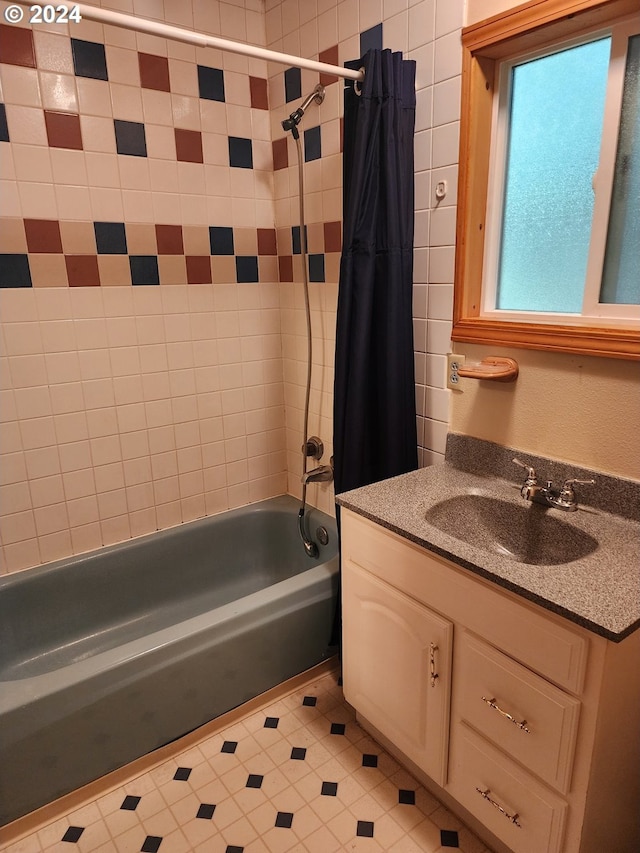 bathroom with shower / tub combo with curtain and vanity