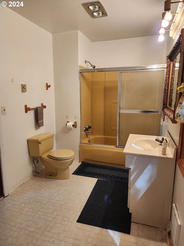 full bathroom featuring vanity, toilet, a baseboard heating unit, and shower / bathtub combination