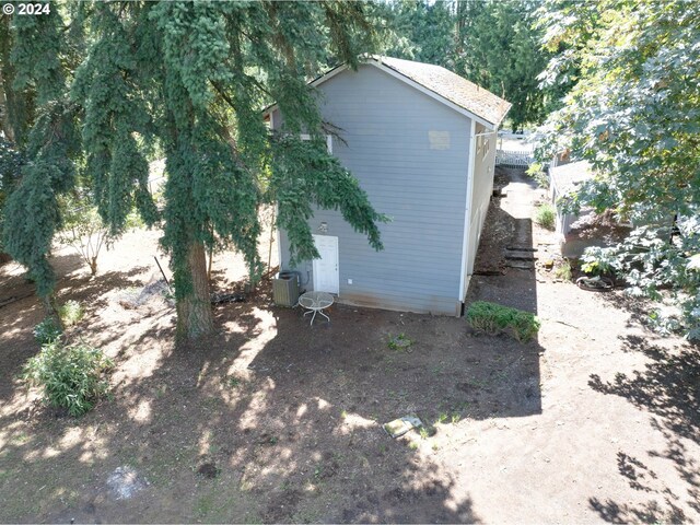 view of side of home featuring central air condition unit