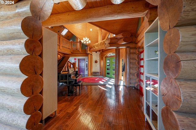 corridor with wood ceiling, wood-type flooring, log walls, lofted ceiling with beams, and an inviting chandelier