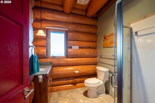 bathroom featuring vanity, tile patterned flooring, an enclosed shower, rustic walls, and toilet