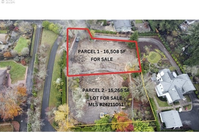 aerial view of property and surrounding area with property parcel outlined