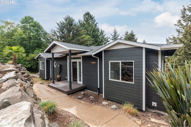 view of front of home with roof with shingles