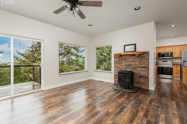 unfurnished living room with baseboards and dark wood-type flooring