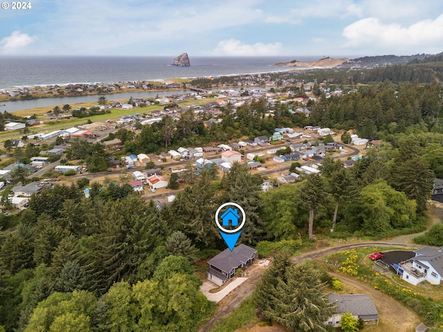 drone / aerial view featuring a water view and a residential view