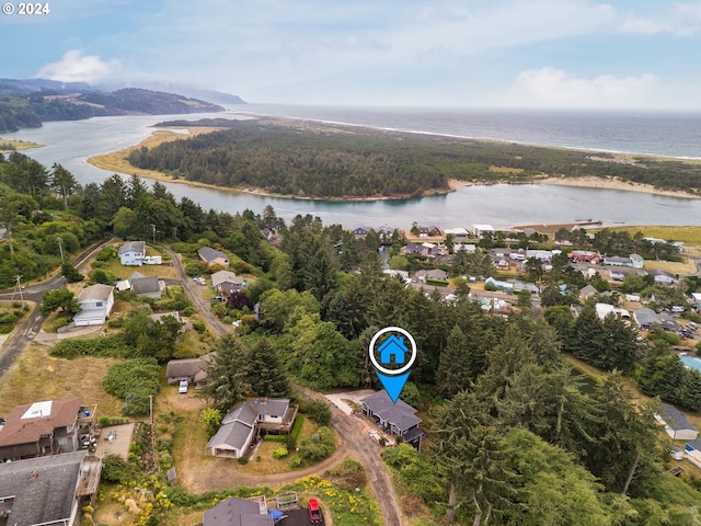 drone / aerial view with a water view and a residential view