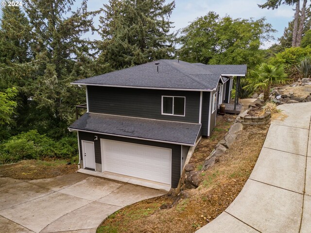 view of side of property featuring a garage