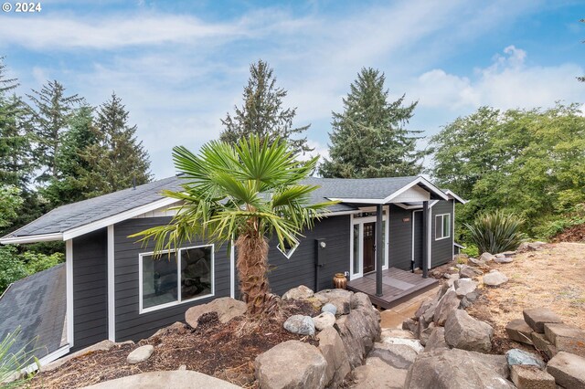 view of front of home featuring a wooden deck