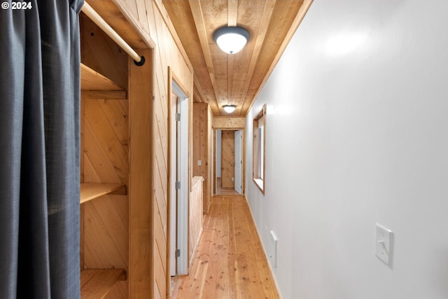 hallway featuring wood ceiling and light wood-type flooring