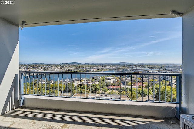 balcony with a water and mountain view