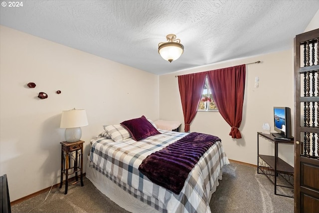 carpeted bedroom with a textured ceiling