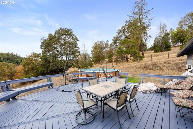 deck with a hot tub