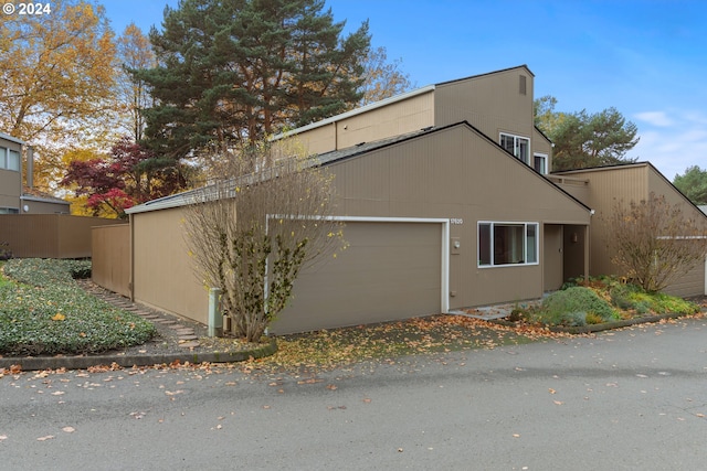 view of side of property featuring a garage