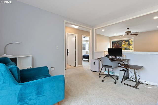 office with light colored carpet and ceiling fan