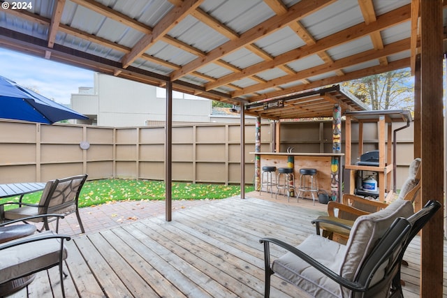 wooden terrace featuring a bar