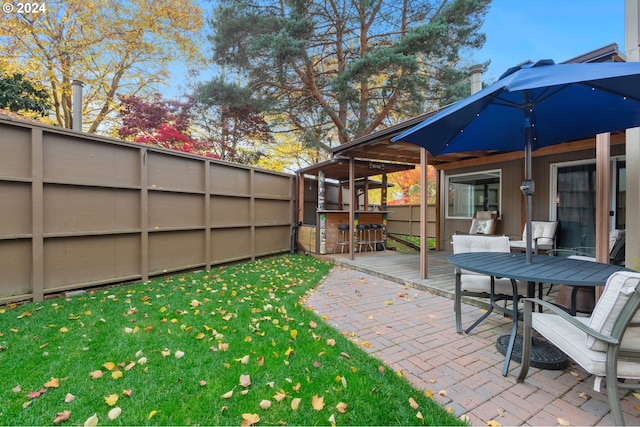 view of yard with an outdoor bar and a patio area