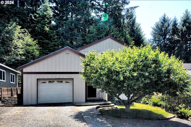 view of front facade with a garage and an outdoor structure