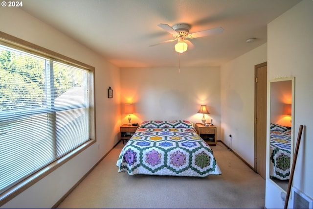 bedroom with light carpet and ceiling fan