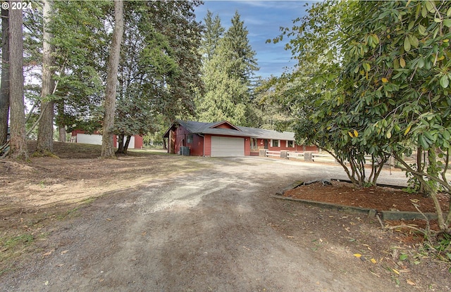 ranch-style house featuring a garage