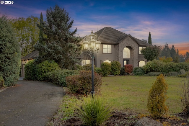 view of front of house with a yard